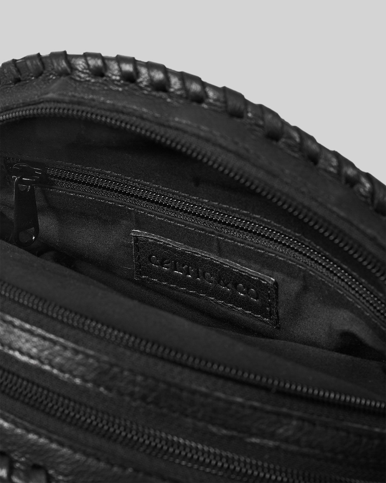 7884_leather-round-cross-body-bag_black_detail_web.jpg